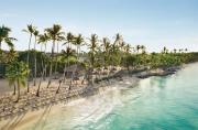Tropical palm trees overlooking the emerald-colored sea at Playa Esmeralda in Miches.