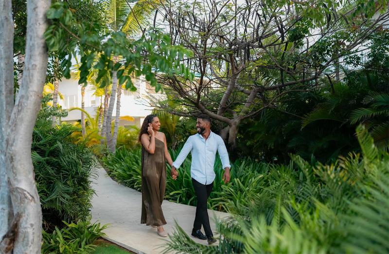 Couple walking on a tropical trail at Playa Esmeralda, Miches.