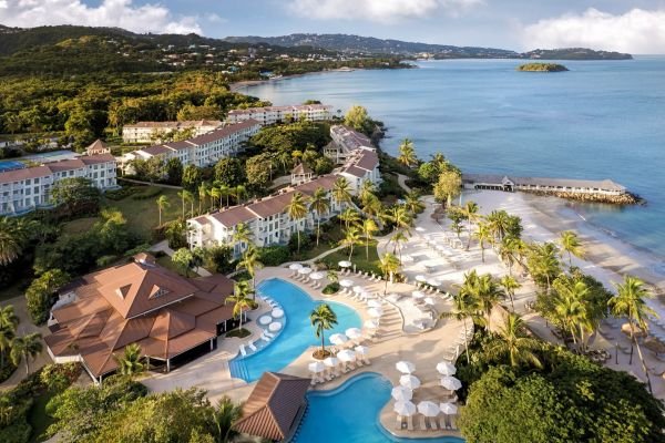 Aerial view of the Secrets Playa Esmeralda Resort & Spa next to the white sand beach and turquoise sea in Miches.
