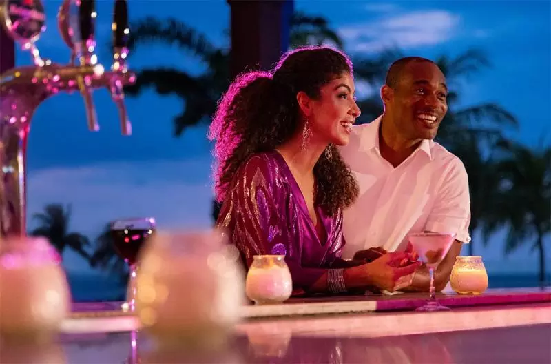 Nighttime oceanfront setting with lights along the coast at Playa Esmeralda, Miches, Dominican Republic.